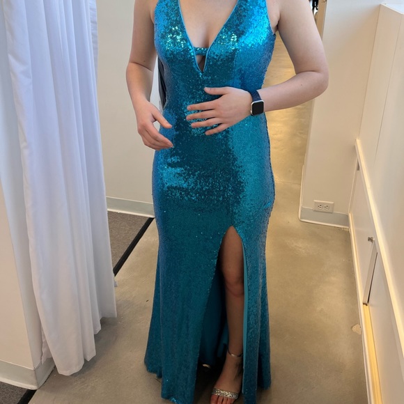 Teal sequin prom dress with an open back and a slit on the left leg - Picture 2 of 3